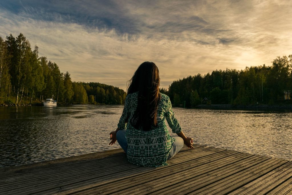 Woman doing meditation to start the day